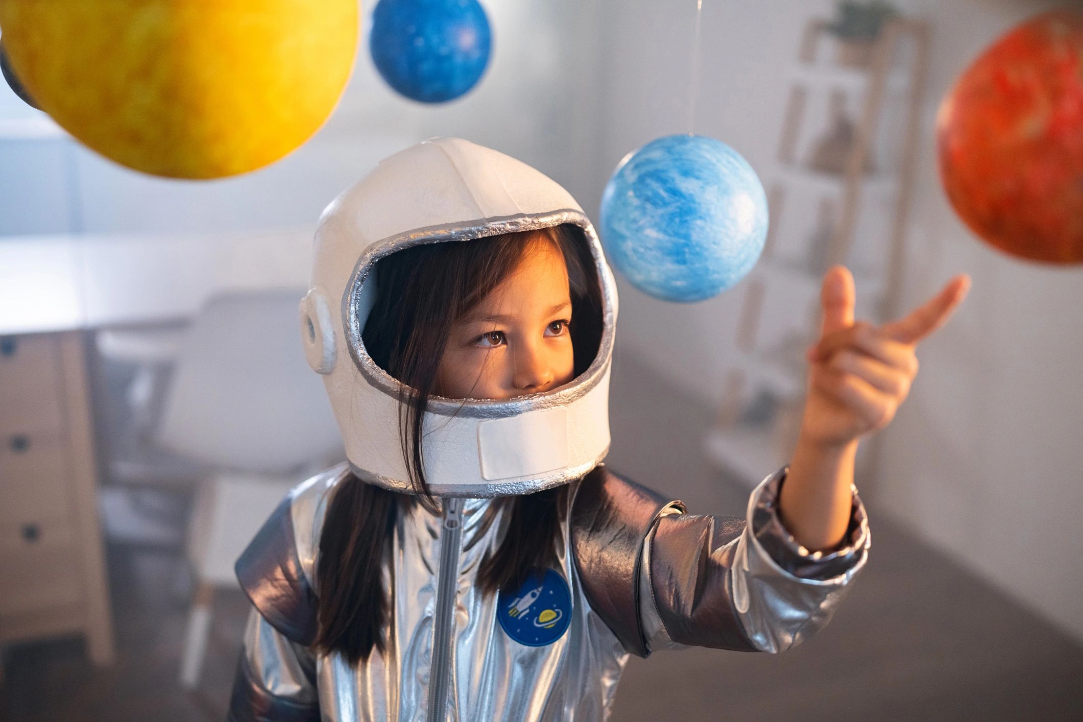Families viewing travel and event photos on a sci-fi themed screen